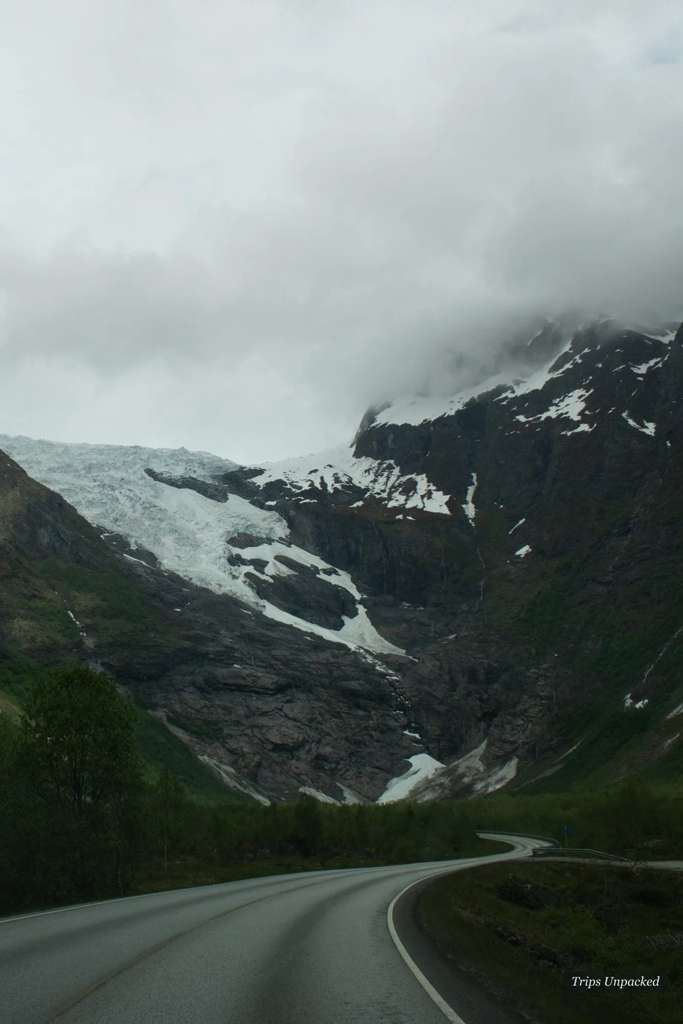 A glacier viewpoint near Stryn - blue-white ice spilling between dark rock.