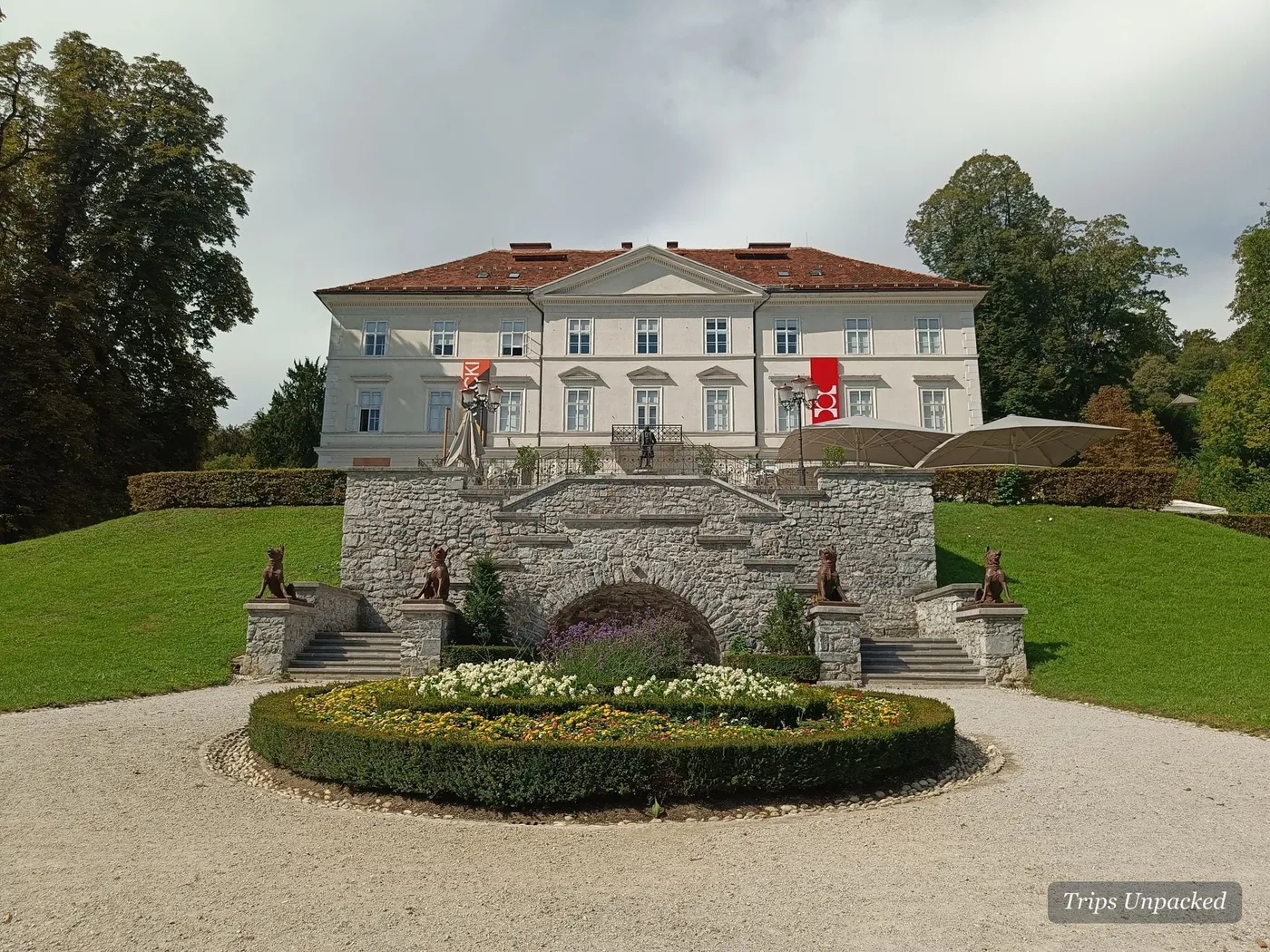 Tivoli Castle (Grad Tivoli) behind its circular flower bed.